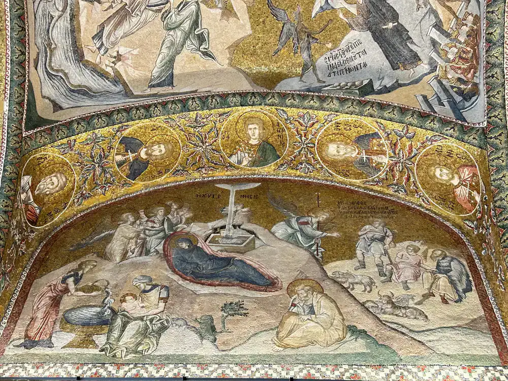 Restored section of a classical church mosaic showing cleaned tesserae next to aged sections
