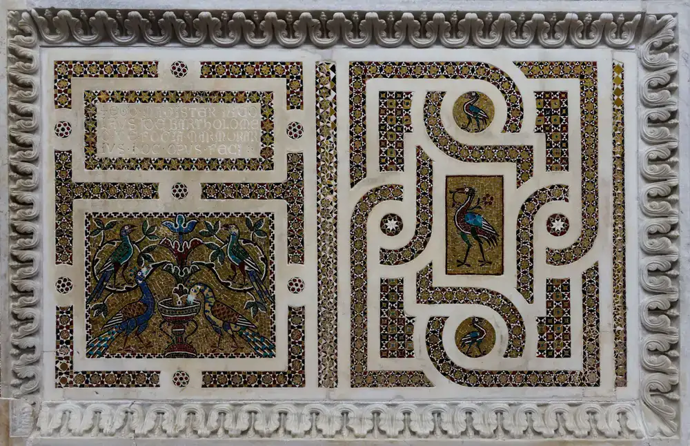 Conservator carefully cleaning a classical mosaic panel